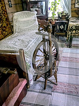 an old wooden spinning wheel in the upper room