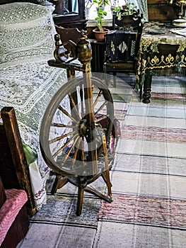 an old wooden spinning wheel in the upper room