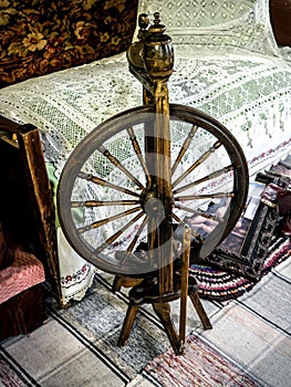 an old wooden spinning wheel in the upper room