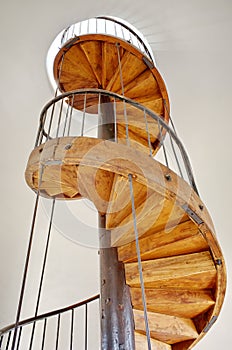 Old wooden spiral staircase - Chindia Tower - landmark attraction in Targoviste, Romania photo