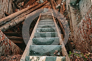 Old wooden staircase descending down.