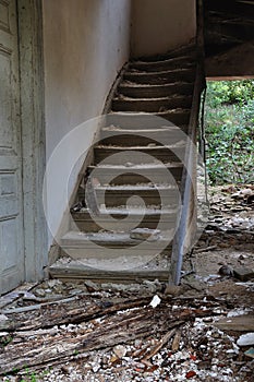 Old wooden staircase and dirty floor