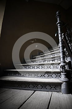 Old wooden stairs in a abandoned tenement house