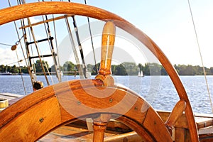 Old wooden steering wheel from the sailing ship