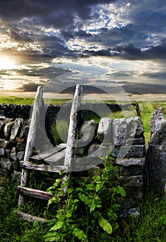 Old wooden stile with countryside