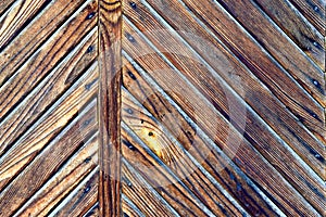 The old wooden surface is a door made of burnt planks
