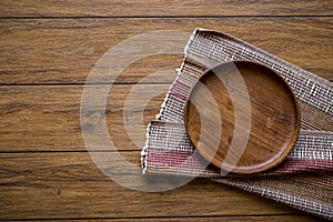 old wooden table with empty plate on a wooden table and copyspace