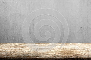 Old wooden table with gray concrete wall background
