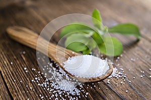 Old wooden table with Stevia Granules (selective focus)