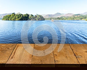 Old wooden table or walkway by lake