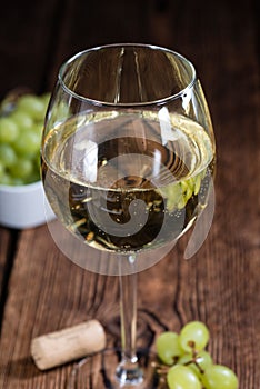 Old wooden table with White Wine