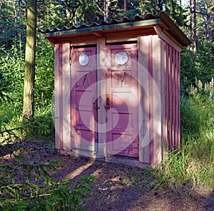 Old wooden toilet near hiking trail