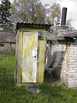 Old wooden toilet in a rustic manor.