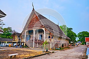 The old wooden Viharn of Wat Koh Walukaram Temple, Lampang, Thailand