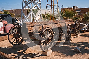 Old wooden wagon and classic car on historic Route 66 in Barstow, USA photo