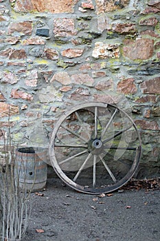 Old wooden wagon wheel and barrel
