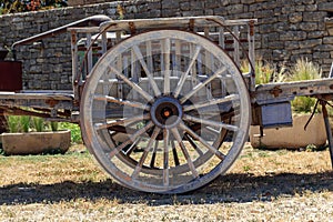 Old wooden wagon wheel, handcraft in perfect condition, vintage public transport