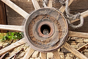 an old wooden wagon wheel with the open hub