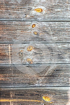 Old wooden wall. Damaged boards