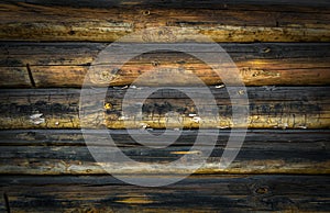 Old wooden wall of logs for background.
