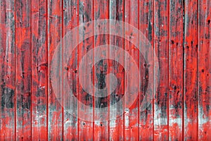 Old wooden wall with red paint. Wooden background with texture amazing texture and chaotic color pattern. Aged from time