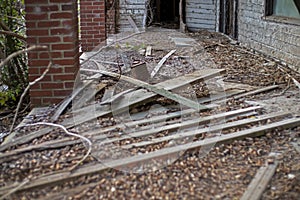 Old wooden weathered dilapidated abandoned two story house scattered waste