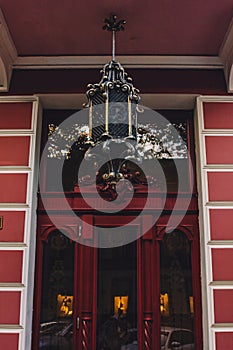 Old wooden weathered door in ancient town architecture.