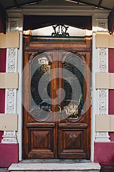 Old wooden weathered door in ancient town architecture.