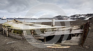 Old wooden whaling boat on the beach at Whaler`s Bay, Antarctica