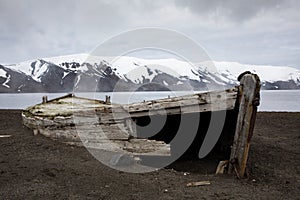 Old wooden whaling boat on the beach at Whaler`s Bay, Antarctica