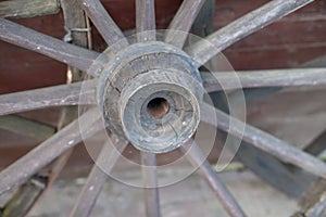 An old wooden wheel from a ladder. Wheel from a wooden wagon fro