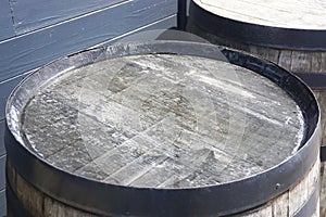 An old wooden whisky barrel in a distillery