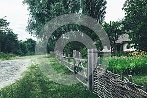 Old wooden wind mill on a grass lawn