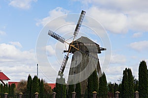 Old wooden wind mill in on a sunny day. Old traditional Dutch mill