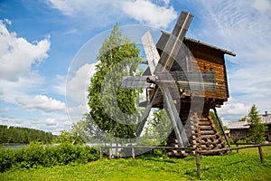 Old wooden windmill in the countryside in Russia