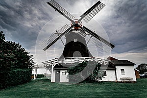 Old wooden windmill in dark tones Germany