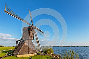 Old wooden windmill in the Dutch province of Friesland