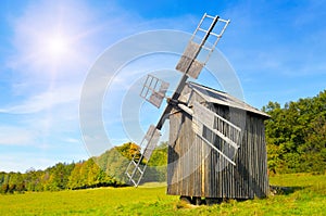 Old wooden windmill in field and sky. Pyrohiv (Pirogovo) village near Kiev, Ukraine