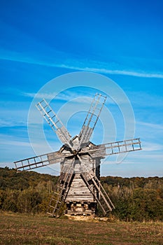 Old wooden windmill on the hill