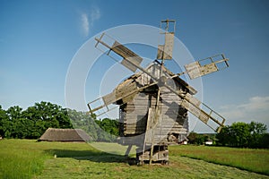 Old wooden windmill in Ukrainian rural settlement