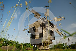 Old wooden windmill in village