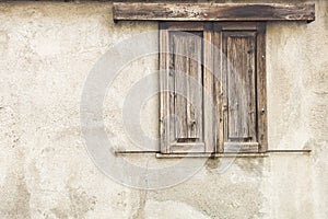 Old wooden window of an ancient house photo