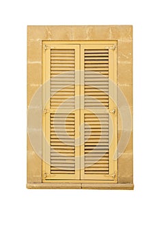 Old wooden window with closed yellow lattice shutters. Vertical. Isolated on a white background