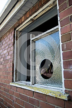 Old wooden window frame being dismantled and removed