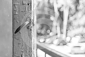 Old wooden window frame with iron latch