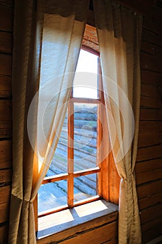 An old wooden window  in retro style. A typical old style country scene