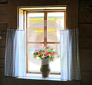 An old wooden window  in retro style. A typical old style country scene