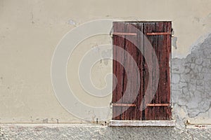 Old wooden window shutters of an mediterranean house, vintage background.