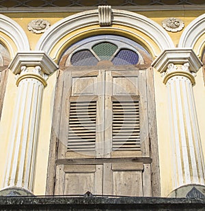 Old wooden window in Sino-Portuguese style at old town