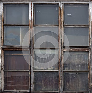 Old wooden window. Vintage frame texture with peeling paint.